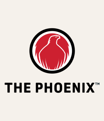 A red phoenix silhouette inside a black and white circle above bold black text that reads THE PHOENIX™ on a light background, symbolizing Community & Events at Austin Bouldering Project.